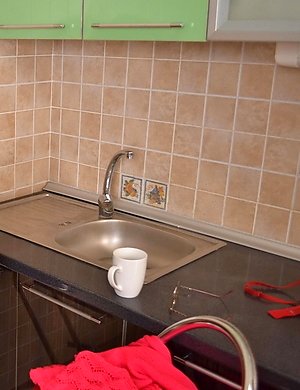 mature lady playing in the kitchen