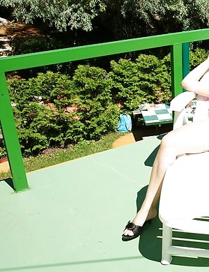 Horny mature slut playing with herself in the sun