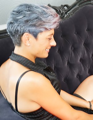 Old and young lesbian couple make out on the couch